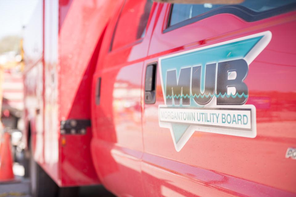 Morgantown Utility Board logo on the door of a red service truck